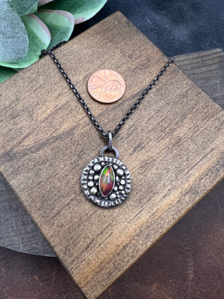 Unblinking Pendant