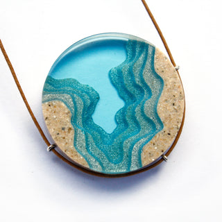 The Abyss Necklace is made from beach sand and colored resin. Beach jewelry