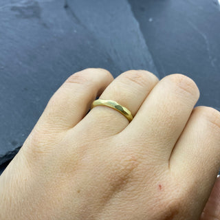 faceted gold band on hand
